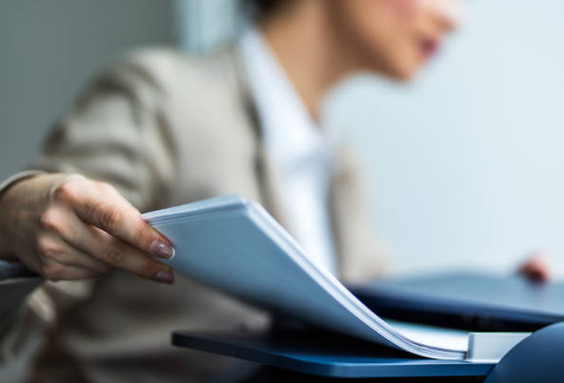 Close up of lawyer faxing legal documents